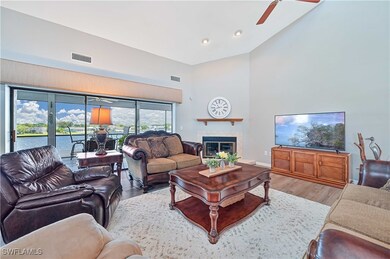 Living room with light hardwood / wood-style floor