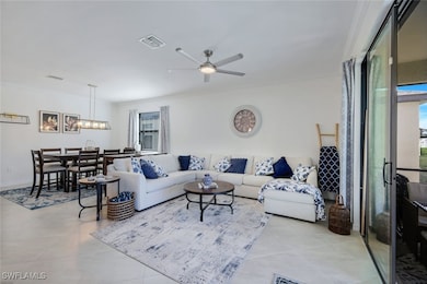 Living area with a ceiling fan, a wealth of natura