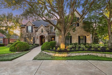 Stately curb appeal with front circle drive, mature oak trees, striking landscaping and lighting set the tone for this lovely home