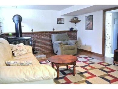 Living Room. Hardwood floors. Woodburner.