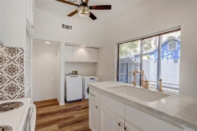 Another view of the kitchen with granite counterto