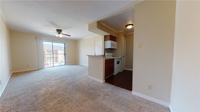 Kitchen with white appliances, ornamental molding,