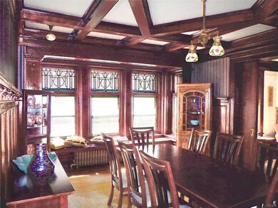 Formal Dining Room with Coffered Ceiling and 5 Lea