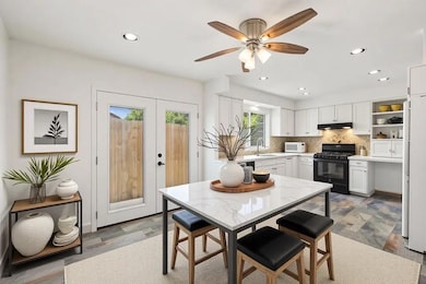 Dining room with recessed lighting, a ceiling fan