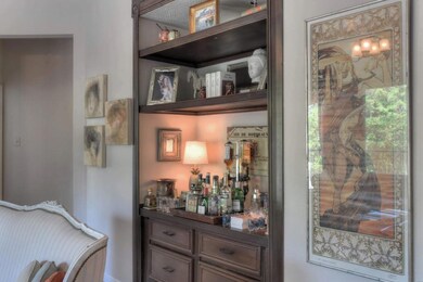 The built-in cabinets are perfect for your bar area or will accommodate a large TV.
