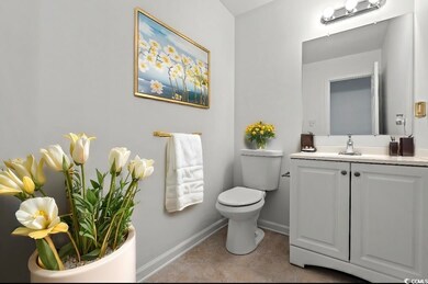 Bathroom featuring vanity and toilet