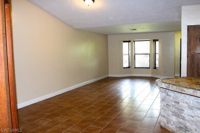 Uncommon, very attractive earthtone tile throughout this home!