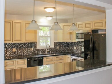 The wide pass-through from kitchen to living room,