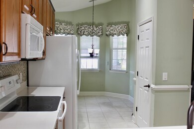 Kitchen featuring a chandelier, light tile pattern