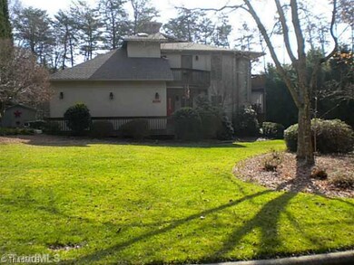 Exterior Front. A large front yard in a peaceful cul-de-sac.