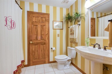 Beautiful Guest Bathroom with Custom Paint and Cer