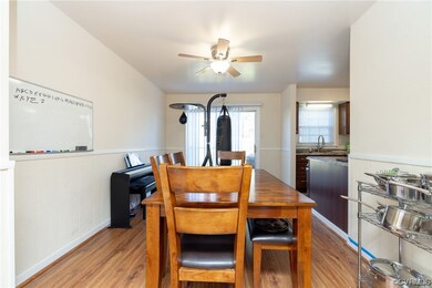 Dining space with ceiling fan and hardwood / wood-style flooring