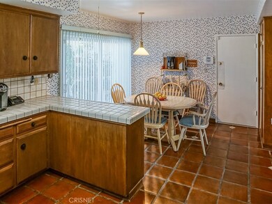 Great kitchen with sliding door to the front patio and direct access to 2 car garage.