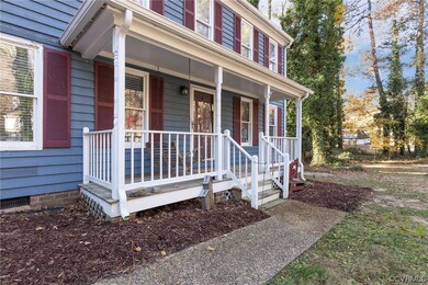 Property entrance with covered porch
