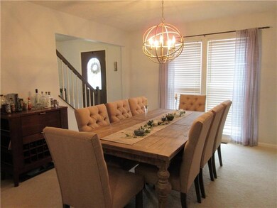 The formal dining room has plenty of room for your