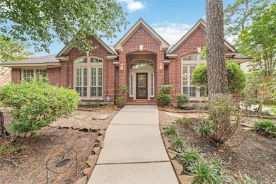 This charming home features a welcoming brick exte