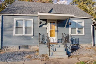 View of front of home featuring roof with shingles