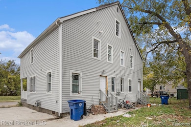 Back of property featuring entry steps and crawl space