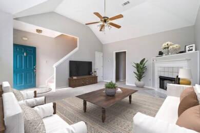 Carpeted living room featuring high vaulted ceilin