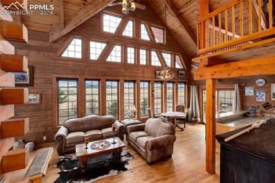 Living room with high vaulted ceiling, wooden ceil