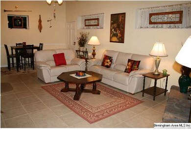 ANOTHER VIEW OF DEN WITH SPACIOUS SEATING AND EATI