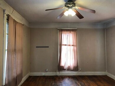 Spare room with ceiling fan and wood-type flooring