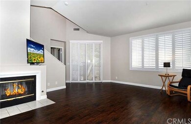 Spacious living room with fireplace, vaulted ceili