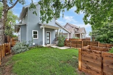 Rear view of house with a vegetable garden