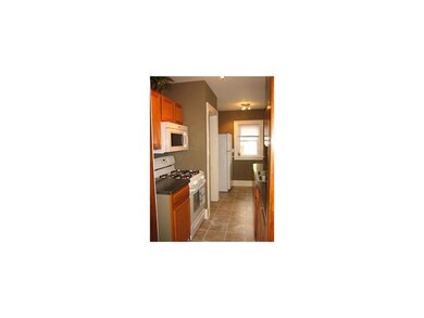 Kitchen. Great galley kitchen with ceramic tile, n