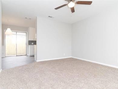 Spare room featuring light colored carpet and a c