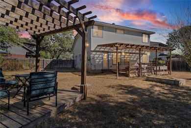 Spacious backyard with pergola covered back deck and additional seating area
