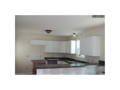 Open kitchen to living room. 1/2 bath off kitchen 