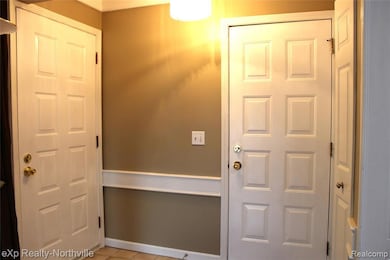 Entrance foyer and entrance from garage