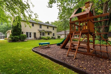 Backyard with raised play area.  Playset does not 