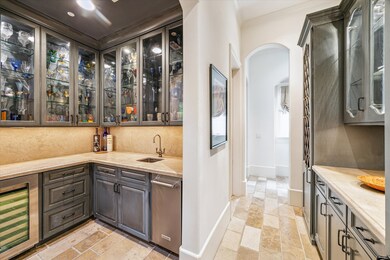 Butlers pantry with elegant built-ins. The walk-in
