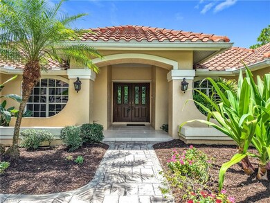 View of exterior entry featuring stucco siding and a tiled roof