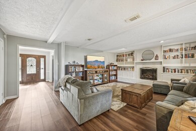 Family room with built-ins and fireplace.  Notice