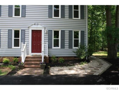 Nicely landscaped with new paved driveway.