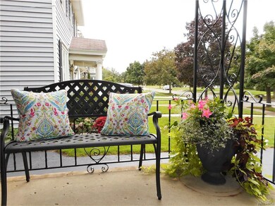 Start off on the cozy and quaint front concrete po
