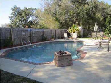 Sparkling in-ground salt water pool with a waterfall