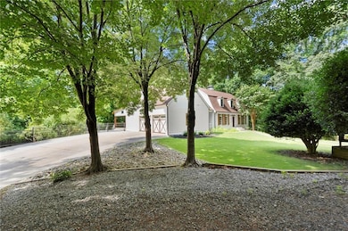 View of front of house with driveway and an attached garage