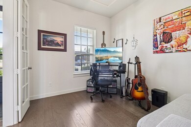 Office space with wood finished floors and french doors