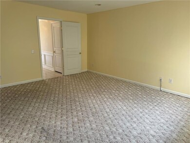 lower level family room opens to a private back ya