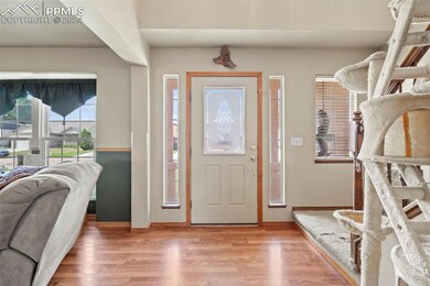 Foyer entrance featuring hardwood / wood-style flo