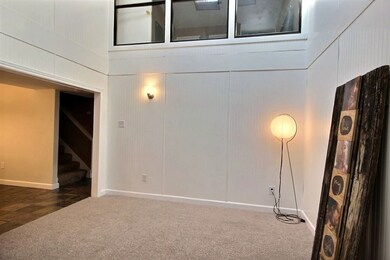 vaulted with skylights & new carpet