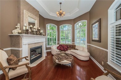 THE FORMAL YET COZY LIVING ROOM WITH GAS FIREPLACE