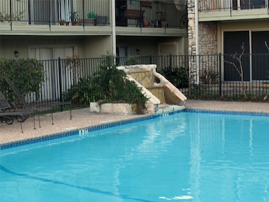 View of pool featuring fence and a fenced in pool