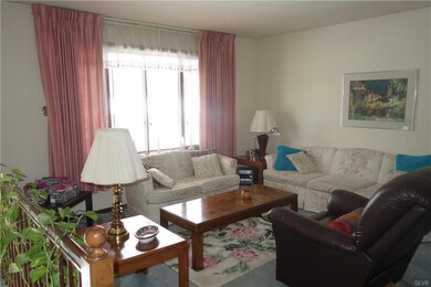Living room, bow window, carpeted