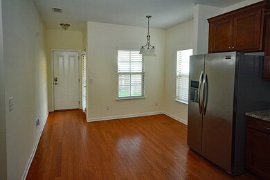 Breakfast nook at the end of the kitchen with easy access to the covered patio out back