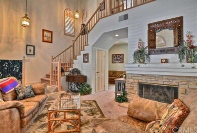 Dramatic curved staircase and soaring ceiling acce